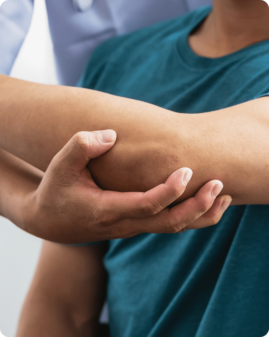 Person receiving elbow examination from therapist.