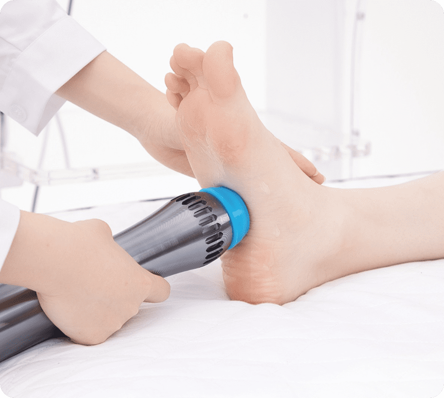 Foot therapy with handheld massage device.