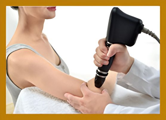 Arm therapy using a handheld massage device.