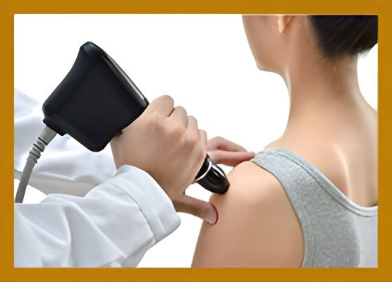 Person receiving shoulder therapy with medical device.